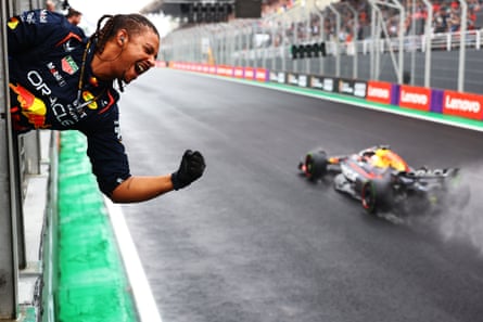 A Red Bull mechanic celebrates as Max Verstappen wins at Interlagos.