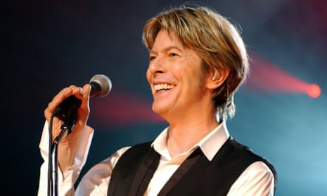 (FILES) This file photo taken on July 1, 2002 shows British singer David Bowie performing in Paris during his only Paris gig. British rock music legend David Bowie has died after a long battle with cancer, his official Twitter and Facebook accounts said on January 11, 2016. Bowie died on Januray 10 surrounded by family according to his social media accounts. The iconic musician had turned 69 only on January 8, which coincided with the release of “Blackstar”, his 25th studio album. / AFP / BERTRAND GUAYBERTRAND GUAY/AFP/Getty Images