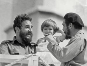 Che Guevara, his daughter Aleida and Fidel Castro, in 1963.