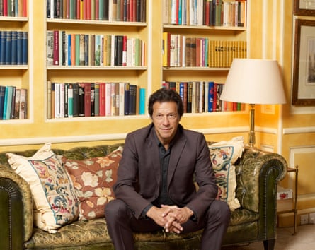 Khan sitting on a sofa with bookshelves behind him at the Goldsmiths mansion in Richmond.