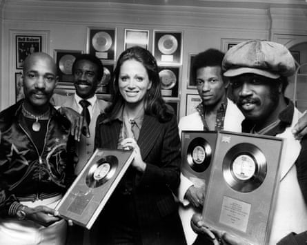 Hot Chocolate – from left, Errol Brown, Larry Ferguson, Tony Wilson and Patrick Olive – receiving silver discs for sales of their single Emma, from the author Jackie Collins in 1974.