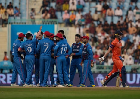 Afghanistan players celebrate the run out of Netherlands’ Sybrand Engelbrecht.