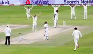 England’s Chris Woakes celebrates taking the wicket of West Indies’ Jason Holder lbw