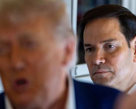 Marco Rubio standing behind Doanld Trump on Air Force One, June 2025.