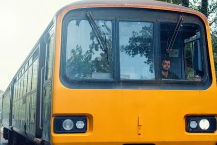 A young man drives a train