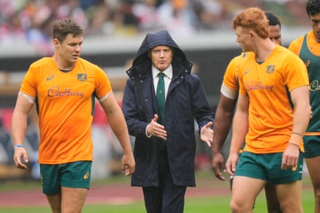 Australia's coach Joe Schmidt talks with his players ahead of the match in Tokyo