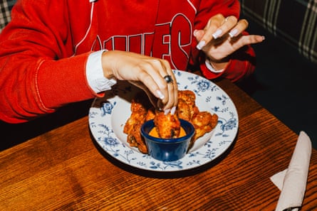 Person eating fried chicken