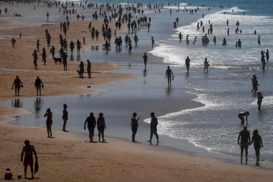 People enjoy the sun at Carcavelos beach in Cascais in the outskirts of Lisbon last Tuesday.