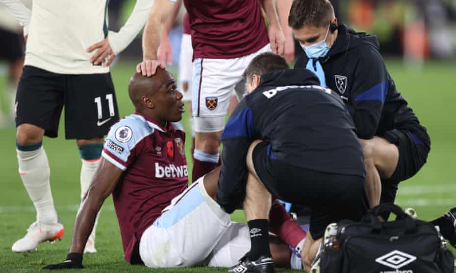 Angelo Ogbonna is treated for his knee injury during West Ham’s win over Liverpool.