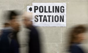 People walk to a polling station in London for the 2015 general election.