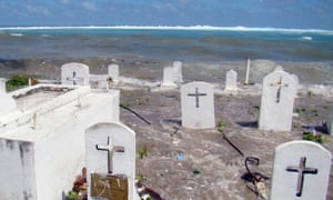 A cemetery on the shoreline in Majuro Atoll, Marshall Islands, flooded from high tides and ocean surges