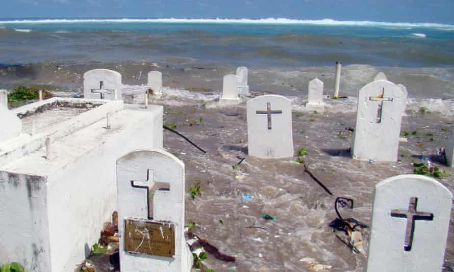 A photo taken in December 2008 shows a cemetery on the shoreline in Majuro Atoll being flooded from high tides and ocean surges in the low-lying Marshall Islands.