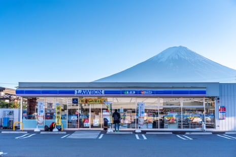 A Lawson convenience store with Mount Fuji behind at Kawaguchiko station