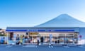 The popular tourist spot with view of a Lawson convenience shop, with view of Mount Fuji behind at Kawaguchiko station