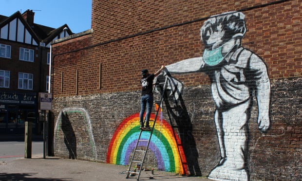 Street artist Chris Shea works on his 100th Rainbow Boy artwork at the Swan pub in West Wickham, south-east London.