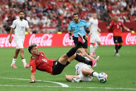Egypt’s Emam Ashour is fouled by Callum McCowatt on the edge of the area.