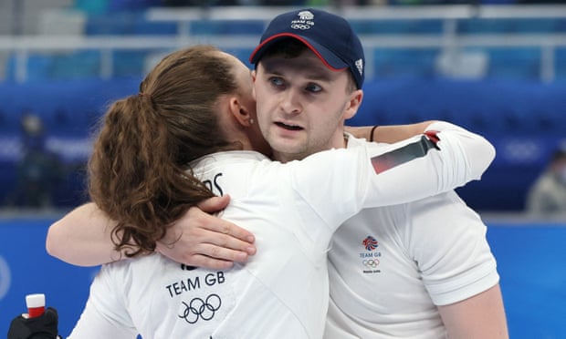 Jennifer Dodds of Britain and Bruce Mouat of Britain react after their match. 