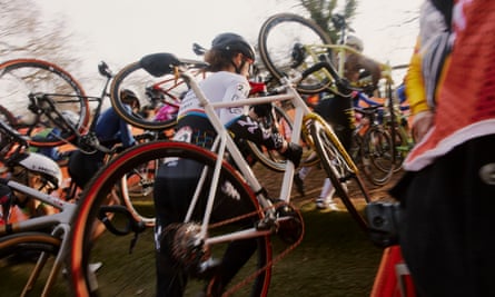 contestants holding bicycles