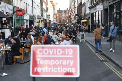 People socialising in Soho, central London, after the lifting of further coronavirus lockdown restrictions in England on 11 July, 2020. Revellers are urged to remember the importance of social distancing as pubs gear up for the second weekend of trade since the lifting of lockdown measures.