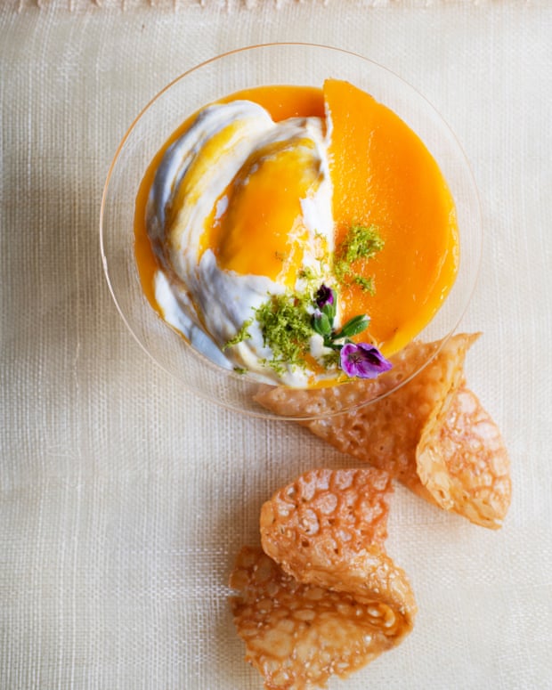 ‘The idea is to have ribbons of mango flowing through the yoghurt’: mango yoghurt fool with sesame rum snaps.