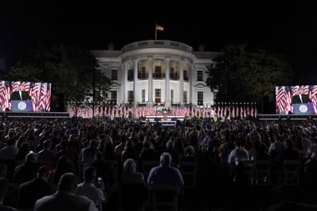 U.S. President Donald Trump, center, speaks during the Republican National Convention on the South Lawn of the White House in Washington, D.C., U.S., on Thursday, Aug. 27, 2020. Trump is asking Americans to return him to office in the speech closing the convention, arguing that voters can’t trust Joe Biden or the Democratic Party to navigate the coronavirus pandemic or salve the nation’s racial divisions.
