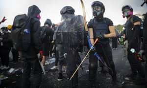 A Hong Kong student prepares a bow and arrow during a protest on Wednesday. 