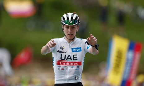UAE Team Emirates' Tadej Pogacar celebrates as he crosses the finish line to win stage 6.