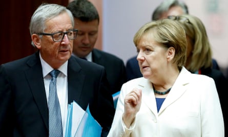 Jean-Claude Juncker and Angela Merkel discuss matters on day two of the EU leaders’ summit.