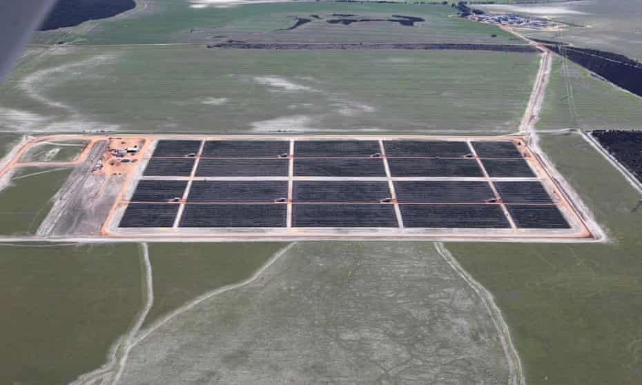 Rows of solar panels face skywards
