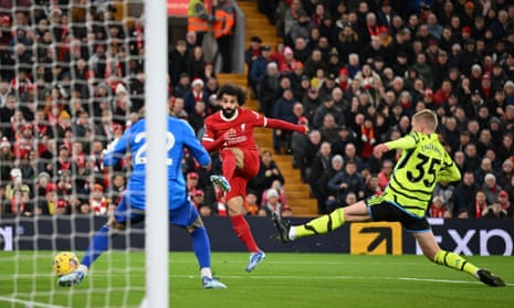 Mohamed Salah of Liverpool shoots wide whilst under pressure from Oleksandr Zinchenko of Arsenal.