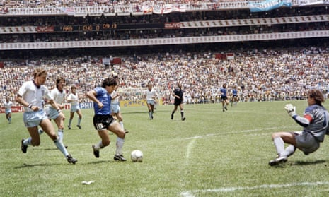 Diego Maradona scores his second goal against England in the 1986 World Cup final.
