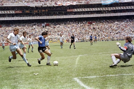 Diego Maradona bears down on England’s goal as he scores a stunning second goal for Argentina.