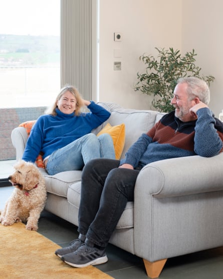 'It needed to feel like a treat': our first holiday without kids in 22 years and the beautiful Welsh cottage where we spent it | More than just a cottage holiday 1 Lucy Dunn and her husband sitting on the sofa in the barn