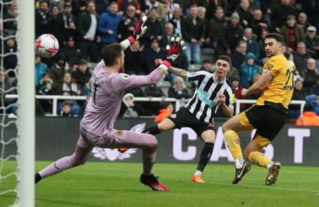 Newcastle United’s Miguel Almiron scores their second goal past Wolverhampton Wanderers’ Jose Sa.