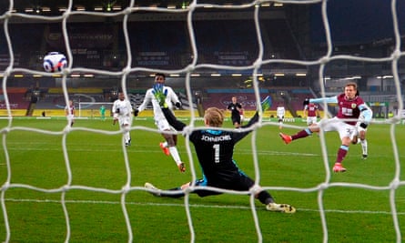 A behind the net photo of Burnley’s Matej Vydra, on the right of the picture, beating Kasper Scheichel with a shot to score the opening goal at Turf Moor.