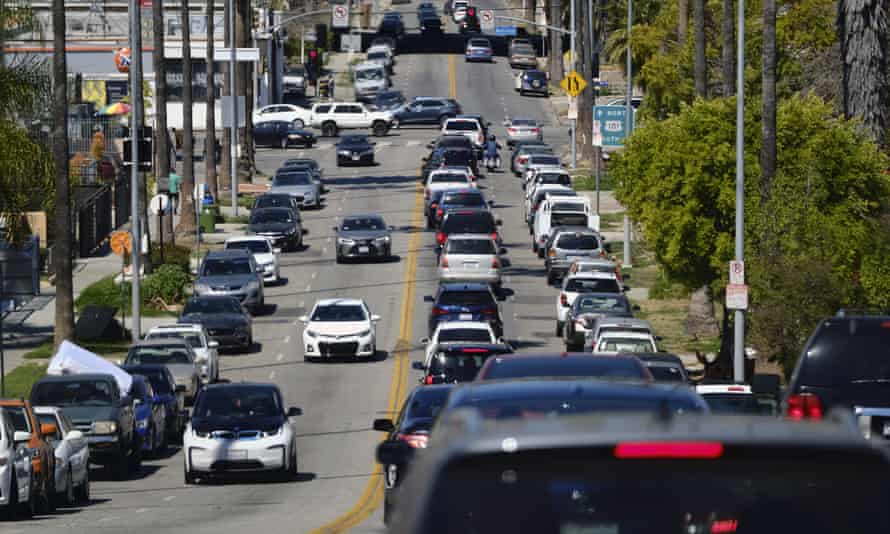 A backed up line of traffic winds its way along a street near downtown Los Angeles.