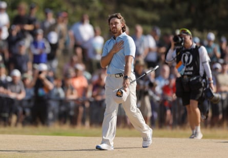 Tommy Fleetwood puts a hand to his chest as he walks up the fairway on the 18th hole on Sunday.