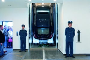 A first-generation Porsche Panamera makes its debut connected the 94th level of the Shanghai World Financial Centre, 2009