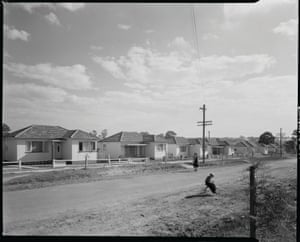 Dirt roads, open air and signs of freshly planted trees signal a new housing development in Bankstown in 1954