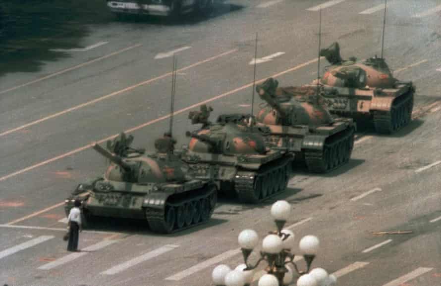 A man stands alone in front of a line of tanks heading east on Beijing’s Changan Blvd in Tiananmen Square, Beijing.