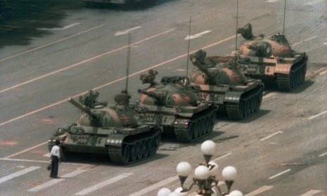 A man stands alone in front of a line of tanks heading east on Beijing's Changan Blvd. in Tiananmen Square, Beijing, 1989.