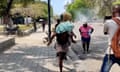Women flee bullets and foreigners are evacuated as attacks continue in the Haitian capital