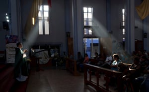 Fernando Cuevas, of the Scalabrinian Missionaries, celebrates Mass at a Catholic church in Ciudad Tecun Uman, Guatemala, on the border with Mexico.