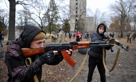 Ukrainians attend an open military training session in Kyiv.
