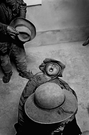 Kami, 1986 BOLIVIA. Village of Kami. 1986. Sick child in a health care centre. Kami is located in the Andes, 4500 meters above the sea level, 7 hours by jeep from La Paz. It was founded in 1908 as a mining village. 6000 people live in it. Life expectancy is 30/35 years of age. There are gold, silver, tin, antimony, and tungsten mines.