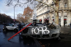 An upturned vandalised car