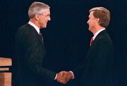 Lloyd Bentsent left, shakes hands with Dan Quayle before the start of their vice presidential debate in Omaha, Nebraska, in 1988.