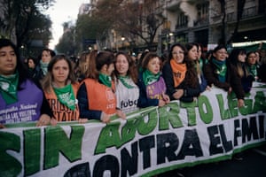 Thousands of protesters march through the    streets in Buenos Aires to demand legal abortion, on 4 June.