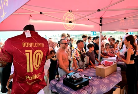 Fans queue for merchandise including shirts featuring Ronaldinho’s name and number