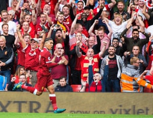 Roberto Firmino and the Liverpool fans celebrate his opening goal against Arsenal at Anfield.
